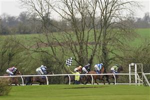 WINCANTON, ENGLAND - JANUARY 21: Groundstaff wave a flag to let the jockeys know to bypass the next fence during The Use The racingtv.com Tracker Handicap Chase at Wincanton Racecourse on January 21, 2021 in Wincanton, England. Due to the Coronavirus pandemic, owners along with the paying public will not be allowed to attend the meeting. (Photo by Alan Crowhurst/Getty Images)