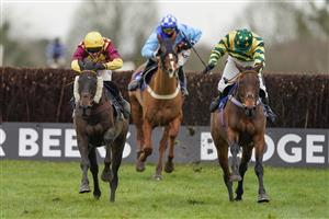 WINCANTON, ENGLAND - JANUARY 21: David Noonan riding Favori de Sivola (L, yellow, maroon) clear the last to win The Use The racingtv.com Tracker Handicap Chase at Wincanton Racecourse on January 21, 2021 in Wincanton, England. Due to the Coronavirus pandemic, owners along with the paying public will not be allowed to attend the meeting. (Photo by Alan Crowhurst/Getty Images)