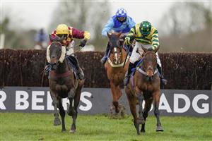 WINCANTON, ENGLAND - JANUARY 21: David Noonan riding Favori de Sivola (L, yellow, maroon) clear the last to win The Use The racingtv.com Tracker Handicap Chase at Wincanton Racecourse on January 21, 2021 in Wincanton, England. Due to the Coronavirus pandemic, owners along with the paying public will not be allowed to attend the meeting. (Photo by Alan Crowhurst/Getty Images)