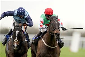 WINCANTON, ENGLAND - JANUARY 21: Millie Wonnacott riding Dawson City (R) clear the last to win The Somerset National Handicap Chase from Harry Cobden and Kings Writ (L) at Wincanton Racecourse on January 21, 2021 in Wincanton, England. Due to the Coronavirus pandemic, owners along with the paying public will not be allowed to attend the meeting. (Photo by Alan Crowhurst/Getty Images)