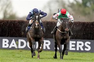 WINCANTON, ENGLAND - JANUARY 21: Millie Wonnacott riding Dawson City (R) clear the last to win The Somerset National Handicap Chase from Harry Cobden and Kings Writ (L) at Wincanton Racecourse on January 21, 2021 in Wincanton, England. Due to the Coronavirus pandemic, owners along with the paying public will not be allowed to attend the meeting. (Photo by Alan Crowhurst/Getty Images)