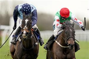 WINCANTON, ENGLAND - JANUARY 21: Millie Wonnacott riding Dawson City (R) clear the last to win The Somerset National Handicap Chase from Harry Cobden and Kings Writ (L) at Wincanton Racecourse on January 21, 2021 in Wincanton, England. Due to the Coronavirus pandemic, owners along with the paying public will not be allowed to attend the meeting. (Photo by Alan Crowhurst/Getty Images)