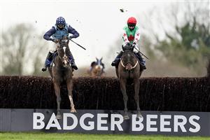 WINCANTON, ENGLAND - JANUARY 21: Millie Wonnacott riding Dawson City (R) clear the last to win The Somerset National Handicap Chase from Harry Cobden and Kings Writ (L) at Wincanton Racecourse on January 21, 2021 in Wincanton, England. Due to the Coronavirus pandemic, owners along with the paying public will not be allowed to attend the meeting. (Photo by Alan Crowhurst/Getty Images)