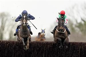 WINCANTON, ENGLAND - JANUARY 21: Millie Wonnacott riding Dawson City (R) clear the last to win The Somerset National Handicap Chase from Harry Cobden and Kings Writ (L) at Wincanton Racecourse on January 21, 2021 in Wincanton, England. Due to the Coronavirus pandemic, owners along with the paying public will not be allowed to attend the meeting. (Photo by Alan Crowhurst/Getty Images)