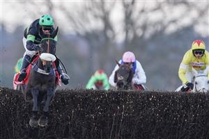ASCOT, ENGLAND - JANUARY 23: David Bass riding First Flow clear the last to win The Matchbook Betting Exchange Clarence House Chase at Ascot Racecourse on January 23, 2021 in Ascot, England. Due to the Coronavirus pandemic, owners along with the paying public will not be allowed to attend the meeting. (Photo by Alan Crowhurst/Getty Images)