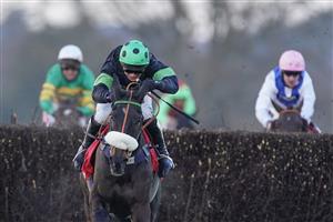 ASCOT, ENGLAND - JANUARY 23: David Bass riding First Flow clear the last to win The Matchbook Betting Exchange Clarence House Chase at Ascot Racecourse on January 23, 2021 in Ascot, England. Due to the Coronavirus pandemic, owners along with the paying public will not be allowed to attend the meeting. (Photo by Alan Crowhurst/Getty Images)