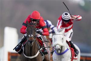 ASCOT, ENGLAND - JANUARY 23: Tom Cannon riding Craigneiche (red) clear the last to win The Matchbook Better Way To Bet Holloway's Handicap Hurdle at Ascot Racecourse on January 23, 2021 in Ascot, England. Due to the Coronavirus pandemic, owners along with the paying public will not be allowed to attend the meeting. (Photo by Alan Crowhurst/Getty Images)