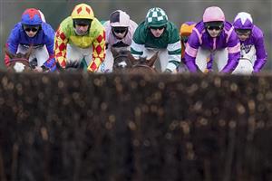 ASCOT, ENGLAND - JANUARY 23: Charlie Hammond riding Enqarde (green) on their way to winning The Matchbook Best Odds Handicap Chase at Ascot Racecourse on January 23, 2021 in Ascot, England. Due to the Coronavirus pandemic, owners along with the paying public will not be allowed to attend the meeting. (Photo by Alan Crowhurst/Getty Images)