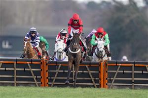 ASCOT, ENGLAND - JANUARY 23: Tom Cannon riding Craigneiche (red) clear the last to win The Matchbook Better Way To Bet Holloway's Handicap Hurdle at Ascot Racecourse on January 23, 2021 in Ascot, England. Due to the Coronavirus pandemic, owners along with the paying public will not be allowed to attend the meeting. (Photo by Alan Crowhurst/Getty Images)
