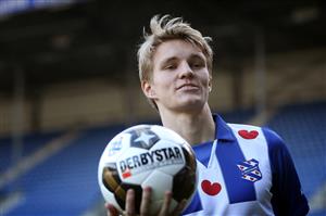 Norwegian Martin Odegaard holds a ball during his press presentation as SC Heerenveen