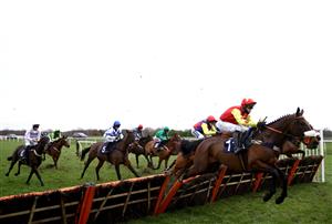 DONCASTER, ENGLAND - JANUARY 29: The Edgar Wallace ridden by David Bass (right) clears a fence as they compete in the Sporting Life EBF 'National Hunt' Maiden Hurdle at Doncaster Racecourse on January 29, 2021 in Doncaster, England. (Photo by Tim Goode - Pool/Getty Images)