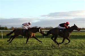 DONCASTER, ENGLAND - JANUARY 29: Finisher ridden by Theo Gillard (L) comes from behind to be the eventual winner of the Play ITV7 Tomorrow Novices' Handicap Hurdle at Doncaster Racecourse on January 29, 2021 in Doncaster, England. (Photo by Tim Goode - Pool/Getty Images)