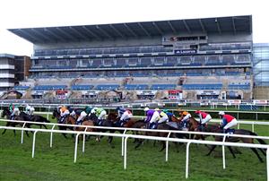 DONCASTER, ENGLAND - JANUARY 29: Runners and riders pass the empty grandstand as they compete in the First Race Special On Sky Bet Tomorrow Novices' Hurdle at Doncaster Racecourse on January 29, 2021 in Doncaster, England. (Photo by Tim Goode - Pool/Getty Images)
