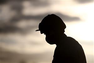 DONCASTER, ENGLAND - JANUARY 29: A silhouette of a jockey wearing a face mask as they make their way out for the Play ITV7 Tomorrow Novices' Handicap Hurdle at Doncaster Racecourse on January 29, 2021 in Doncaster, England. (Photo by Tim Goode - Pool/Getty Images)