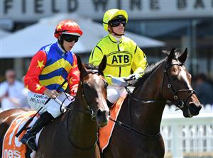 MELBOURNE, AUSTRALIA - JANUARY 30: Damian Lane riding War Critic and Jamie Kah riding Hassletoff after Race 3, the Neds Toolbox Handicap, during Melbourne Racing at Caulfield Racecourse on January 30, 2021 in Melbourne, Australia. (Photo by Vince Caligiuri/Getty Images)