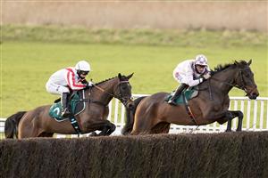 WARWICK, ENGLAND - FEBRUARY 03: Bridget Andrews riding Latenightpass (L) on their way to winning The Willoughby De Broke Open Hunters' Chase at Warwick Racecourse on February 03, 2021 in Warwick, England. Due to the Coronavirus pandemic, owners along with the paying public will not be allowed to attend the meeting. (Photo by Alan Crowhurst/Getty Images)
