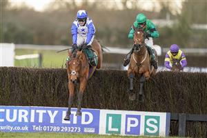 WARWICK, ENGLAND - FEBRUARY 03: Jonjo O'Neill Jr. riding Annie Mc (blue) clear the last to win The Lady Protectress Mares' Chase at Warwick Racecourse on February 03, 2021 in Warwick, England. Due to the Coronavirus pandemic, owners along with the paying public will not be allowed to attend the meeting. (Photo by Alan Crowhurst/Getty Images)