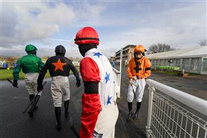 WARWICK, ENGLAND - FEBRUARY 03: Jockeys make their way to the parade ring for the first race of the day at Warwick Racecourse on February 03, 2021 in Warwick, England. Due to the Coronavirus pandemic, owners along with the paying public will not be allowed to attend the meeting. (Photo by Alan Crowhurst/Getty Images)