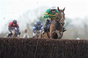 WINCANTON, ENGLAND - FEBRUARY 04 Jonjo O'Neill Jr. riding Time To Get Up (green) clear the last to win The Dick Hunt Handicap Chase at Wincanton Racecourse on February 04, 2021 in Wincanton, England. Due to the Coronavirus pandemic, owners along with the paying public will not be allowed to attend the meeting. (Photo by Alan Crowhurst/Getty Images)