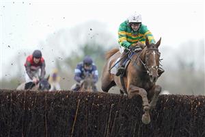 WINCANTON, ENGLAND - FEBRUARY 04 Jonjo O'Neill Jr. riding Time To Get Up (green) clear the last to win The Dick Hunt Handicap Chase at Wincanton Racecourse on February 04, 2021 in Wincanton, England. Due to the Coronavirus pandemic, owners along with the paying public will not be allowed to attend the meeting. (Photo by Alan Crowhurst/Getty Images)