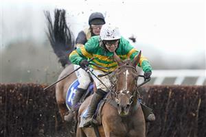 WINCANTON, ENGLAND - FEBRUARY 04 Jonjo O'Neill Jr. riding Time To Get Up (green) clear the last to win The Dick Hunt Handicap Chase at Wincanton Racecourse on February 04, 2021 in Wincanton, England. Due to the Coronavirus pandemic, owners along with the paying public will not be allowed to attend the meeting. (Photo by Alan Crowhurst/Getty Images)