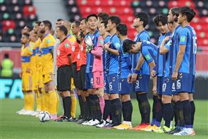 Players gather on the pitch ahead of the FIFA Club World Cup second round football match between Mexico