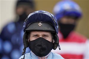 WINCANTON, ENGLAND - FEBRUARY 04: A masked Richard Johnson at Wincanton Racecourse on February 04, 2021 in Wincanton, England. Due to the Coronavirus pandemic, owners along with the paying public will not be allowed to attend the meeting. (Photo by Alan Crowhurst/Getty Images)