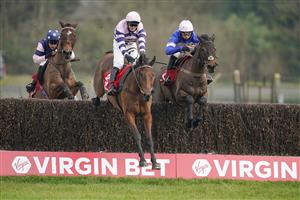 ESHER, ENGLAND - FEBRUARY 06: David Bass riding Moonlighter (C) clear the last to win The Virgin Bet Handicap Chase at Sandown Park Racecourse on February 06, 2021 in Esher, England. Due to the Coronavirus pandemic, owners along with the paying public will not be allowed to attend the meeting. (Photo by Alan Crowhurst/Getty Images)
