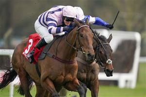 ESHER, ENGLAND - FEBRUARY 06: David Bass riding Moonlighter (L) clear the last to win The Virgin Bet Handicap Chase at Sandown Park Racecourse on February 06, 2021 in Esher, England. Due to the Coronavirus pandemic, owners along with the paying public will not be allowed to attend the meeting. (Photo by Alan Crowhurst/Getty Images)
