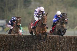 ESHER, ENGLAND - FEBRUARY 06: Richard Johnson riding Sporting John (green) clear the last to win The Virgin Bet Scilly Isles Novices' Chase from Shan Blue and Harry Skelton at Sandown Park Racecourse on February 06, 2021 in Esher, England. Due to the Coronavirus pandemic, owners along with the paying public will not be allowed to attend the meeting. (Photo by Alan Crowhurst/Getty Images)
