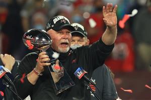 TAMPA, FLORIDA - FEBRUARY 07: Head coach Bruce Arians of the Tampa Bay Buccaneers lifts the Lombardi Trophy after defeating the Kansas City Chiefs in Super Bowl LV at Raymond James Stadium on February 07, 2021 in Tampa, Florida. The Buccaneers defeated the Chiefs 31-9. (Photo by Mike Ehrmann/Getty Images)