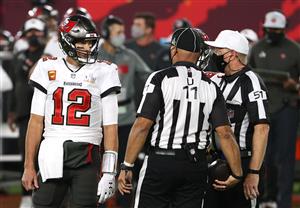 TAMPA, FLORIDA - FEBRUARY 07: Tom Brady #12 of the Tampa Bay Buccaneers speaks with umpire Fred Bryan #11 and referee Carl Cheffers #51 during the second quarter in Super Bowl LV at Raymond James Stadium on February 07, 2021 in Tampa, Florida. (Photo by Patrick Smith/Getty Images)