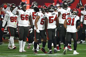TAMPA, FLORIDA - FEBRUARY 07: The Tampa Bay Buccaneers celebrate a defensive stop during the third quarter against the Tampa Bay Buccaneers in Super Bowl LV at Raymond James Stadium on February 07, 2021 in Tampa, Florida. (Photo by Patrick Smith/Getty Images)