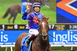 SYDNEY, AUSTRALIA - FEBRUARY 06: Hugh Bowman on Profiteer returns to scale after winning race 5 the Inglis Millennium during Sydney Racing at Royal Randwick Racecourse on February 06, 2021 in Sydney, Australia. (Photo by Mark Evans/Getty Images)
