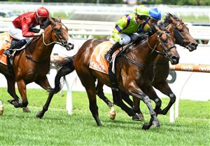 MELBOURNE, AUSTRALIA - FEBRUARY 06: Jamie Kah riding General Beau defeats Damien Oliver riding Anamoe in Race 3, the Neds Blue Diamond Prelude C&g, during C.F. Orr Stakes Day at Caulfield Racecourse on February 06, 2021 in Melbourne, Australia. (Photo by Vince Caligiuri/Getty Images)