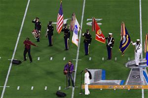 TAMPA, FLORIDA - FEBRUARY 07: Jazmine Sullivan and Eric Church perform the national anthem in Super Bowl LV at Raymond James Stadium on February 07, 2021 in Tampa, Florida. (Photo by Mike Ehrmann/Getty Images)
