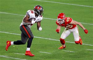 TAMPA, FLORIDA - FEBRUARY 07: Leonard Fournette #28 of the Tampa Bay Buccaneers rushes ahead of Daniel Sorensen #49 of the Kansas City Chiefs during the third quarter of the game in Super Bowl LV at Raymond James Stadium on February 07, 2021 in Tampa, Florida. (Photo by Kevin C. Cox/Getty Images)