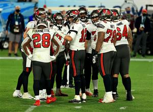 TAMPA, FLORIDA - FEBRUARY 07: Tom Brady #12 of the Tampa Bay Buccaneers reacts with teammates late in the fourth quarter against the Kansas City Chiefs in Super Bowl LV at Raymond James Stadium on February 07, 2021 in Tampa, Florida. (Photo by Mike Ehrmann/Getty Images)