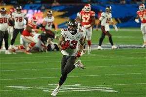 TAMPA, FLORIDA - FEBRUARY 07: Mike Evans #13 of the Tampa Bay Buccaneers rushes after a reception during the second quarter of the game against the Kansas City Chiefs in Super Bowl LV at Raymond James Stadium on February 07, 2021 in Tampa, Florida. (Photo by Mike Ehrmann/Getty Images)