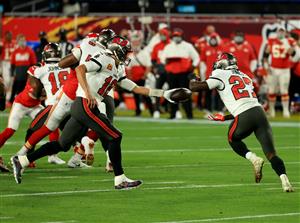 TAMPA, FLORIDA - FEBRUARY 07: Tom Brady #12 of the Tampa Bay Buccaneers hands off to Ronald Jones #27 in the first quarter against the Kansas City Chiefs in Super Bowl LV at Raymond James Stadium on February 07, 2021 in Tampa, Florida. (Photo by Mike Ehrmann/Getty Images)