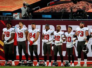 TAMPA, FLORIDA - FEBRUARY 07: The Tampa Bay Buccaneers stand for a pre-game song before Super Bowl LV against the Kansas City Chiefs at Raymond James Stadium on February 07, 2021 in Tampa, Florida. (Photo by Mike Ehrmann/Getty Images)