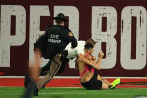 TAMPA, FLORIDA - FEBRUARY 07: A fan is tackled by law enforcement after running on the field during the fourth quarter of Super Bowl LV between the Tampa Bay Buccaneers and the Kansas City Chiefs at Raymond James Stadium on February 07, 2021 in Tampa, Florida. (Photo by Mike Ehrmann/Getty Images)