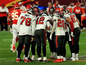TAMPA, FLORIDA - FEBRUARY 07: The Tampa Bay Buccaneers huddle during the third quarter in Super Bowl LV at Raymond James Stadium on February 07, 2021 in Tampa, Florida. (Photo by Mike Ehrmann/Getty Images)