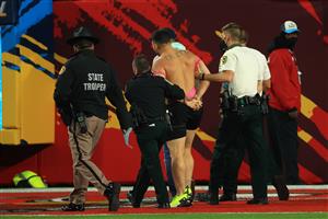 TAMPA, FLORIDA - FEBRUARY 07: A fan is removed from the field by law enforcement after running on the field during the fourth quarter of Super Bowl LV between the Tampa Bay Buccaneers and the Kansas City Chiefs at Raymond James Stadium on February 07, 2021 in Tampa, Florida. (Photo by Mike Ehrmann/Getty Images)