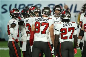 TAMPA, FLORIDA - FEBRUARY 07: The Tampa Bay Buccaneers huddle during the first quarter against the Kansas City Chiefs in Super Bowl LV at Raymond James Stadium on February 07, 2021 in Tampa, Florida. (Photo by Patrick Smith/Getty Images)
