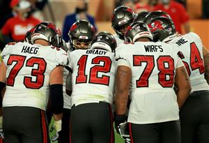 TAMPA, FLORIDA - FEBRUARY 07: The Tampa Bay Buccaneers huddle during the fourth quarter against the Kansas City Chiefs in Super Bowl LV at Raymond James Stadium on February 07, 2021 in Tampa, Florida. (Photo by Mike Ehrmann/Getty Images)