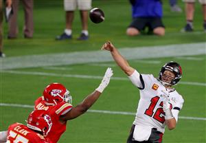 TAMPA, FLORIDA - FEBRUARY 07: Tom Brady #12 of the Tampa Bay Buccaneers passes under pressure from Alex Okafor #57 of the Kansas City Chiefs during the fourth quarter of the game in Super Bowl LV at Raymond James Stadium on February 07, 2021 in Tampa, Florida. (Photo by Kevin C. Cox/Getty Images)
