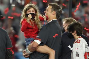 TAMPA, FLORIDA - FEBRUARY 07: Tom Brady #12 of the Tampa Bay Buccaneers hugs his daughter Vivian after defeating the Kansas City Chiefs 31-9 in Super Bowl LV at Raymond James Stadium on February 07, 2021 in Tampa, Florida. (Photo by Patrick Smith/Getty Images)