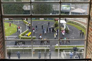 SUNBURY, ENGLAND - FEBRUARY 09: A general view through a window down onto the parade ring at Kempton Park Racecourse on February 09, 2021 in Sunbury, England. Due to the Coronavirus pandemic, owners along with the paying public will not be allowed to attend the meeting. (Photo by Alan Crowhurst/Getty Images)