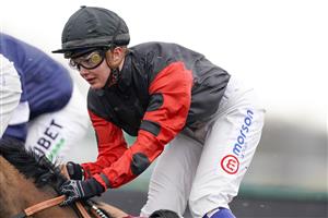SUNBURY, ENGLAND - FEBRUARY 09: Megan Nicholls in action at Kempton Park Racecourse on February 09, 2021 in Sunbury, England. Due to the Coronavirus pandemic, owners along with the paying public will not be allowed to attend the meeting. (Photo by Alan Crowhurst/Getty Images)